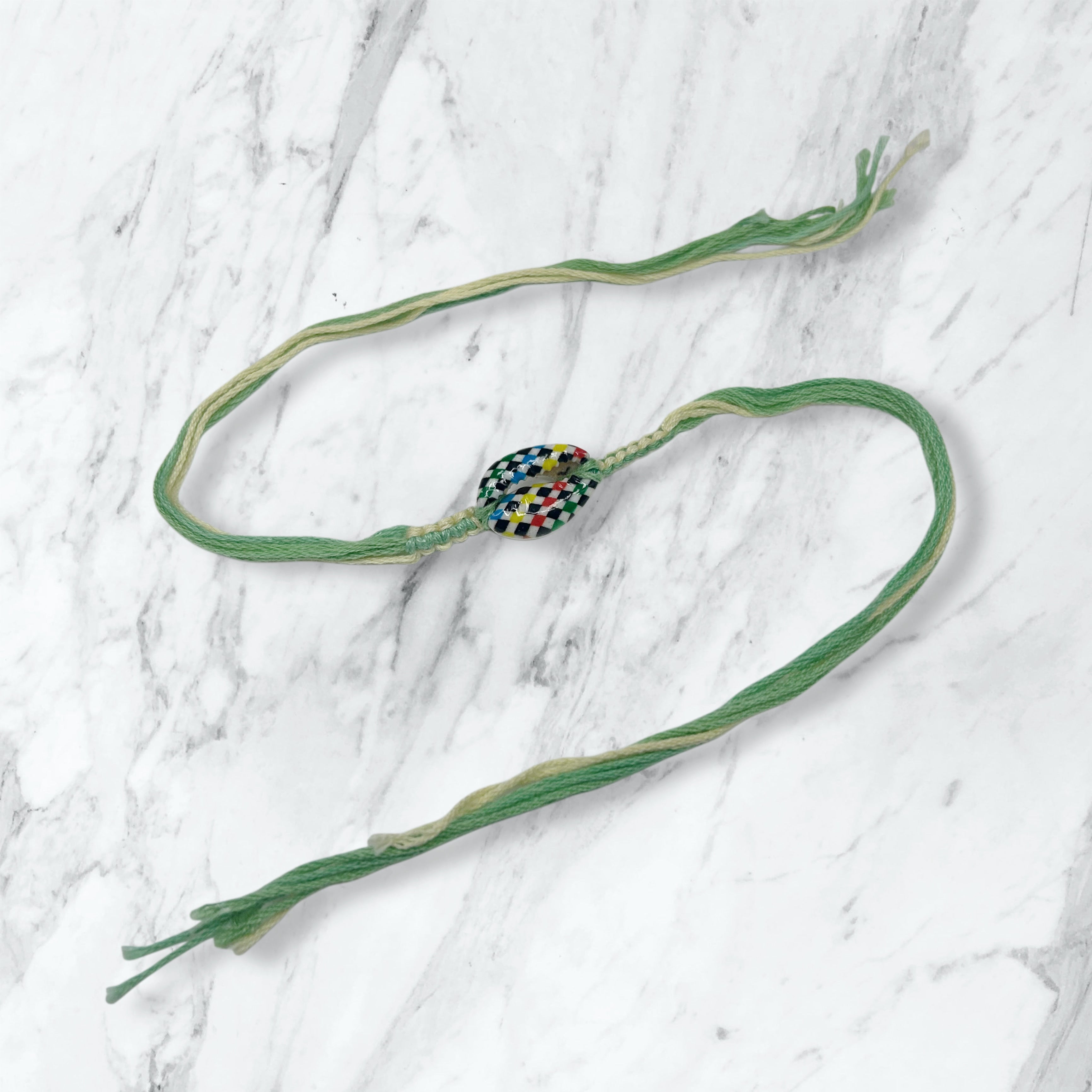 Checkered Kauri Shell Green Thread Rakhi