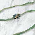 Checkered Kauri Shell Green Thread Rakhi