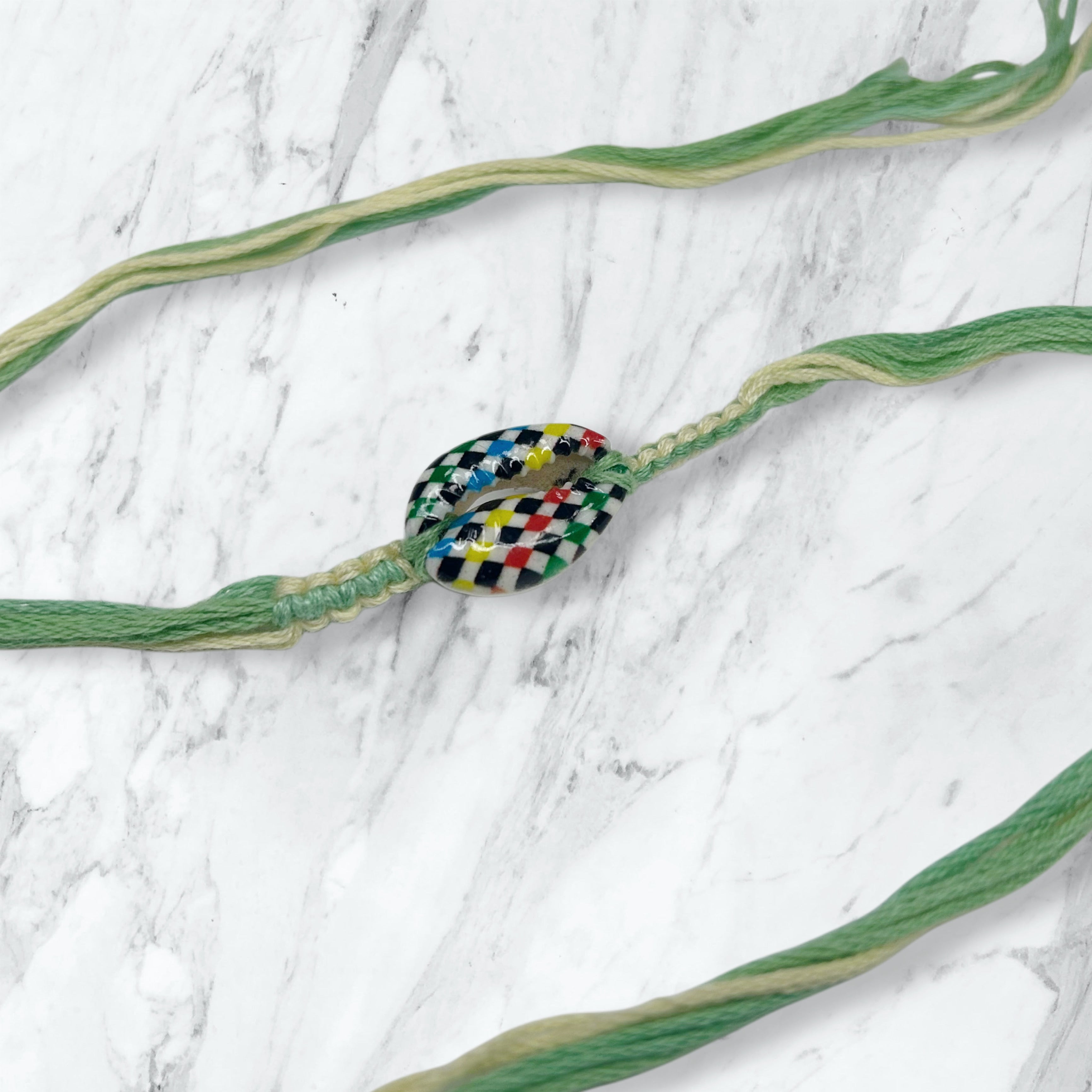 Checkered Kauri Shell Green Thread Rakhi