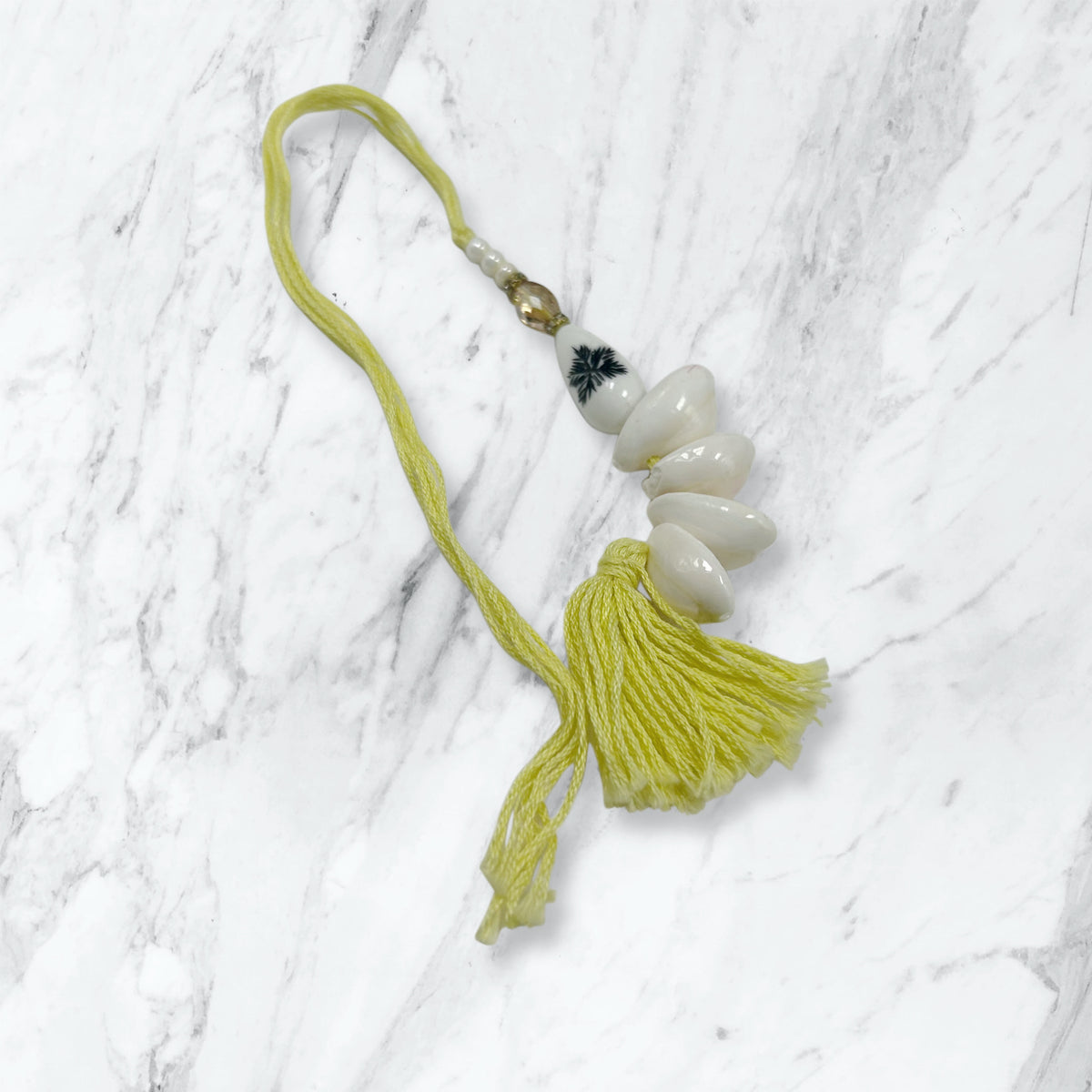 Kauri Shell & Yellow Tassel Lumba Rakhi