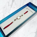 Spinning Mother of Pearl Clover Rakhi Box